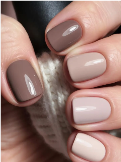 25 Short Fall Nail Ideas for 2026: Chic, Classy & Easy Designs Short fall nail ideas featuring a glossy gradient ombre of neutral brown, taupe, and cream solid polishes on short square nails.