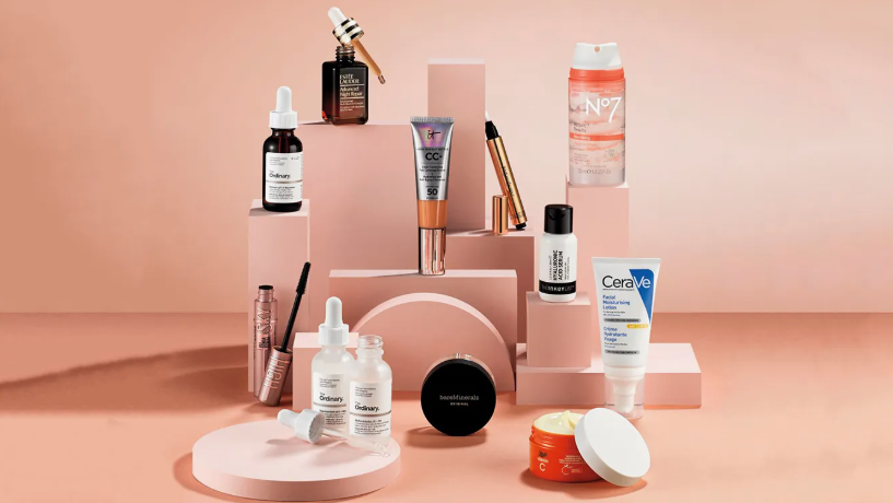 Beauty Products You Actually Need: A Minimalist Guide to Your Beauty Collection A curated display of beauty products you actually need, featuring serums, CC cream, moisturizer, and skincare essentials arranged on geometric pink blocks.