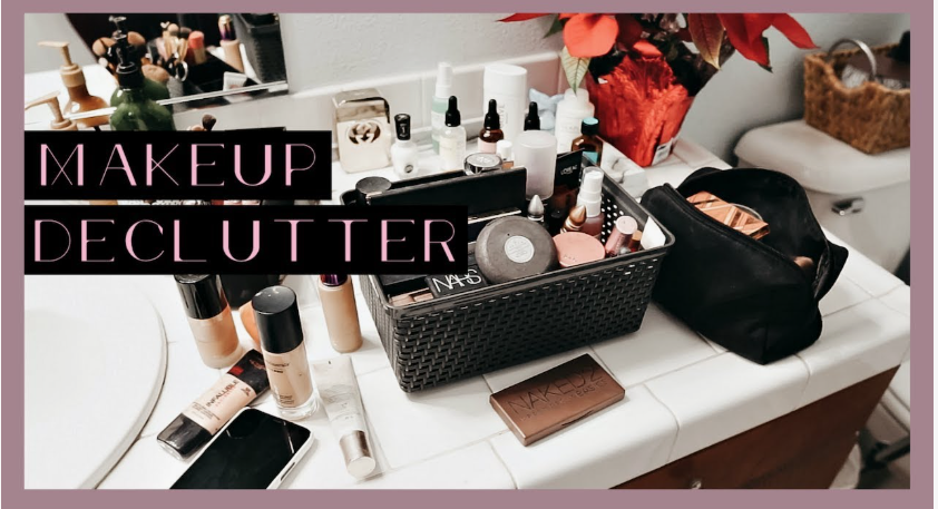 Beauty Products You Actually Need: A Minimalist Guide to Your Beauty Collection A bathroom vanity countertop filled with makeup organizers, foundation bottles, a makeup bag, and an eyeshadow palette for beauty products you actually need.