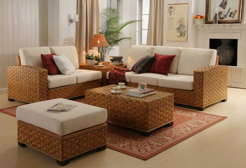 spring living room decor featuring woven wicker furniture sets, cream cushions, and vibrant red accent pillows