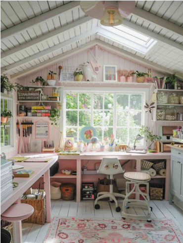 spring living room decor featuring a light-filled craft studio or office space with soft pink walls and white built-in desks