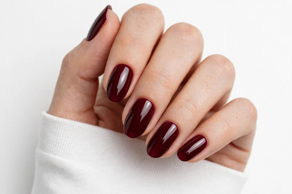 Nails Inspo 2026: 30+ Trendy Nail Ideas to Save Nails inspo 2026 showcasing glossy deep cherry mocha gel polish on elegant oval-shaped nails.