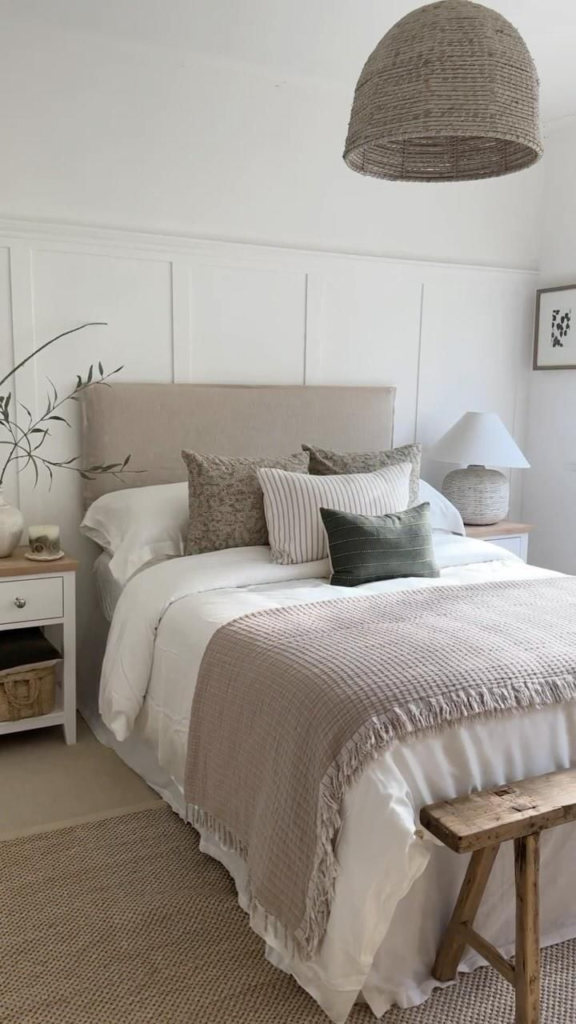 Bedding Set Ideas 2026: 15 Stylish Looks for Your Bedroom Crisp white duvet with fringed throw blanket and patterned accent pillows showing bedding set ideas 2026 in a coastal cottage bedroom.